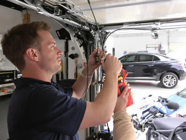 Cypress Garage Door Repair safety certified technician performing cable replacement in Cypress