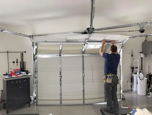 Cypress Garage Door Repair specialist performing precise section replacement on Cypress garage door